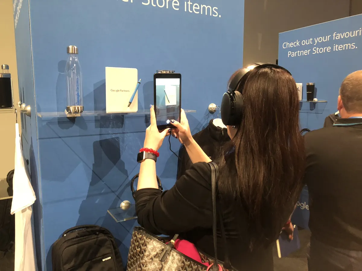 Essen at a Google Partners event, photographing the Partner Store display